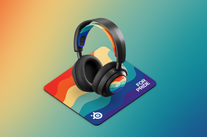 For Pride Arctis Nova Booster Pack, on a Arctis Nova headset, and Qck mousepad that show off the "For Pride" design, which displays a wavy, muted rainbow design. Headset, booster pack, and mousepad are displayed on a gradient rainbow background.