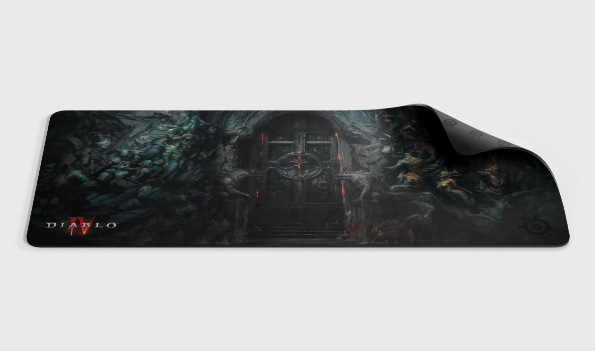 
 An up close top-down view of the Diablo 4 QcK Heavy XXL mousepad with the upper right corner lifted up.
 