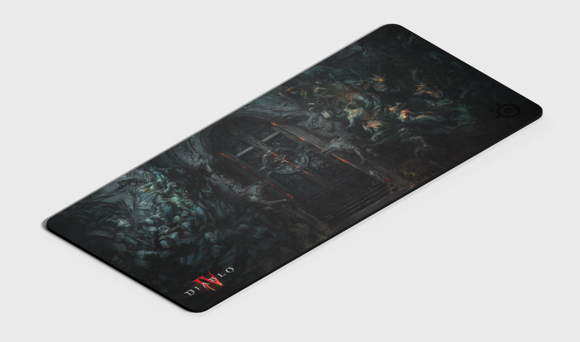 
 An up close angled view of the Diablo 4 QcK Heavy XXL mousepad laying flat.
 